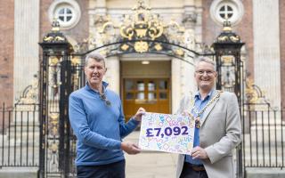 Outgoing Mayor of Worcester, Louis Stephen (right) presenting a cheque of £7,092 to Karel Bretveld, representing Age UK