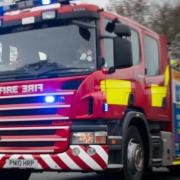 Fire crews rescued two people from a car when it got stuck in a ford on Earls Common Road