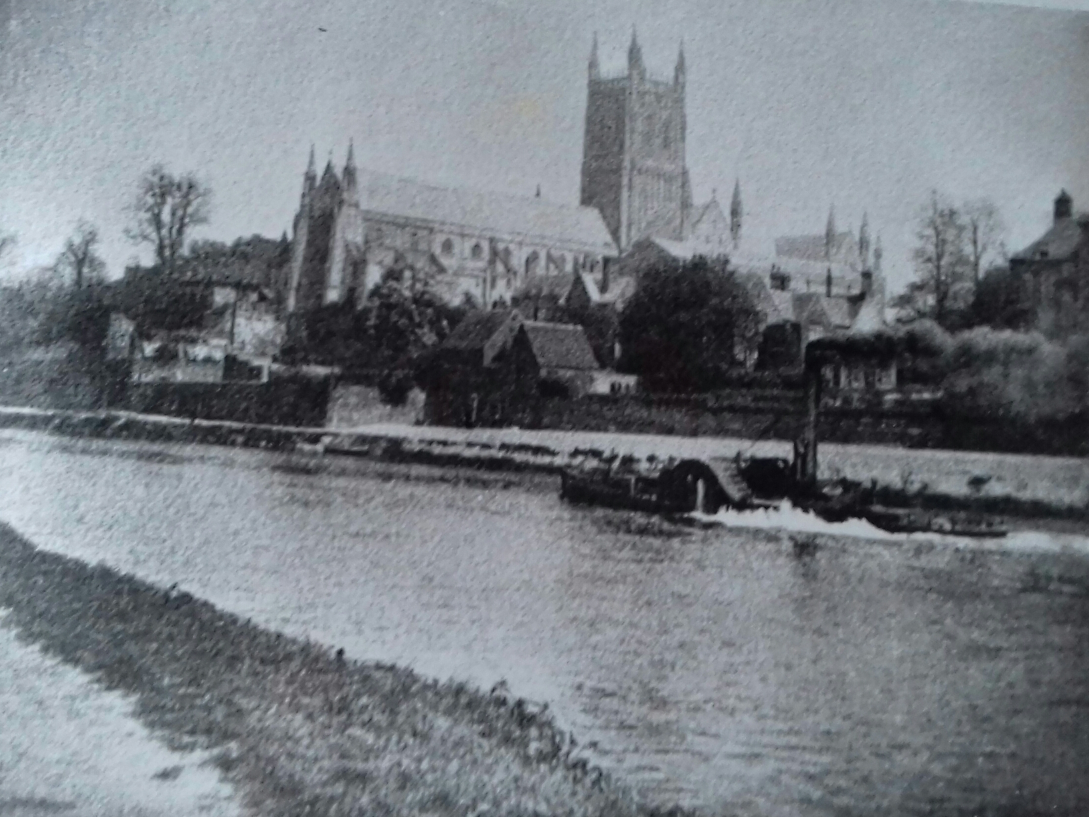 A paddle steamer passes Worcester Cathedral in 1888
