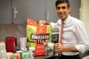 Chancellor Rishi Sunak poses with a big bag of Yorkshire Tea bags