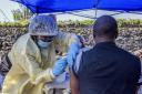A man receives a vaccine against Ebola from a nurse outside the Afia Himbi Health Center on July 15, 2019 in Goma. - Authorities in Democratic Republic of Congo have appealed for calm after a preacher fell ill with Ebola in the eastern city of Goma, the