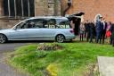 The hearse arrives at St Augustine Church in Droitwich