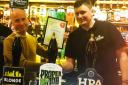 Stourbridge and Halesowen Branch of CAMRA chairman Tim Cadwell handing over the Pub of the Year award to Ben Jeavons