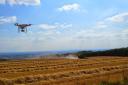 FLYING HIGH: The Quadcopter video camera drone takes to the air above Overbury Farm.