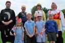 PARTY TIME: Chawson First School youngsters (l-r) Annalise Evans, Dylan Rees, Nuala Anderson, James Walton, with the Norbury Players who entertained school children at their royal birthday party