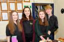Some of the older WODYS get ready to serve cakes at the Macmillan coffee morning – from left to right, Emma Fradgley, Hana Copestake, Grace Whyte and George Baylis