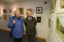 Visitors Margaret and Eric Miller enjoy some of the work in the Cotswold Art Club Exhibition at the Corinium Museum. Photos by Simon Pizzey