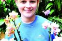 FLOWER POWER: Customer service assistant Emma Gibson.