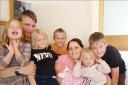 FAMILY: The McCaffertys, from left – Esmae, Luke, Ruby, Harley, Becci with baby Aurora, Livia and Braydon. Becci has incurable cancer and wants to take her children on holiday.