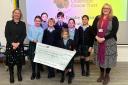 Pupils from RGS Springfield present their cheque.
