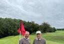 HOLE IN ONE: Warren McDivitt congratulating Bob Matthews (pictured on Right) on his remarkable achievement