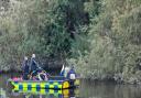 Police were pictured in an underwater search boat where the suspected 19-year-old went missing.
