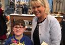 HONOUR: Henry Prior, one of four Almonry children for Queen Camilla's visit, with Suzanne Clarke, churchwarden and ALM for  Pershore Abbey and Chair of Governors for Orchard Primary in Pershore