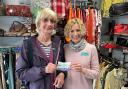 The raffle winner, Rita Bullock (left) and St Richard's Hospice Upton shop manager Clare Griffiths (left) pictured with the winning ticket