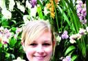FLOWER POWER: Customer service assistant Emma Gibson.