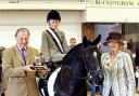 AWARD: Jessica Thomas, aged 11, is presented with one of her four trophies she picked up at the national side saddle championships. Picture courtesy of emmpix.co.uk.