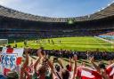 CHEERFUL: England fans in good voice at Estadio Mineirao, despite their team's disappointing performance