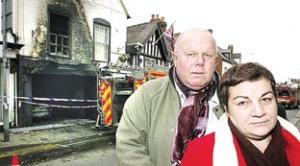 Owners Andy and Maria Ward are pictured outside the Talbot Hotel after the blaze in March 2009.