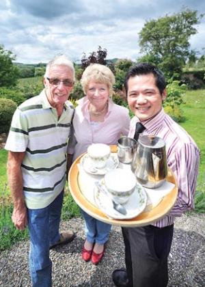 TEA-TIME: From left, Alan Green,  open garden organiser; Pam Thompson, of Pear Tree Cottage; and Davy Ling, of the Four Seasons restaurant. 25300906.