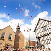 HIGH IN THE SKY: The balloons are released by mourners in Evesham (07433604)