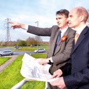 MAKING A POINT: Labour candidate Mike Foster, left, with Lord Andrew Adonis at the Ketch roundabout in Worcester. Picture by Paul Jackson. 15471301