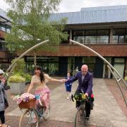 ISABELLE NECESSARY ON A BICYCLE: Isabelle Michel and Terry McCarthy cycling away from the wedding ceremony at County Hall