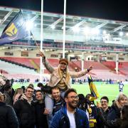 Worcester Warriors fans and staff celebrate the win after the game - Mandatory by-line: Andy Watts/JMP - 27/04/2022 - RUGBY - Kingsholm Stadium - Gloucester, England - Gloucester Rugby v Worcester Warriors - Premiership Rugby Cup Semi-Final