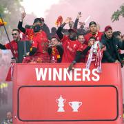 Liverpool players on an open-top bus during the trophy parade in Liverpool. Picture date: Sunday May 29, 2022..