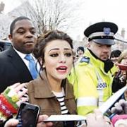 Mobbed: Cher Lloyd outisde her old primary school in Malvern this morning. Picture: Newsteam