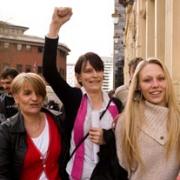 VICTORY: Kim Smith, centre, shows her relief outside Birmingham Crown Court
