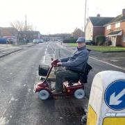 RISKS: John Hughes crosses Cranham Drive in his mobility scooter