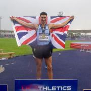 Joel Clarke-Khan celebrates winning a third British high jump title in Manchester