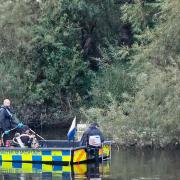 Police were pictured in an underwater search boat where the suspected 19-year-old went missing.