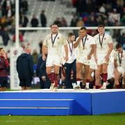 Ollie Lawrence and his England teammates with their bronze medals after the 26-23 win over Argentina