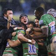 Leicester Tigers mob Jamie Shillcock after he scored the winning penalty