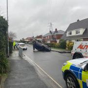 CRASH: The car on its roof in Himbleton Road, St Johns
