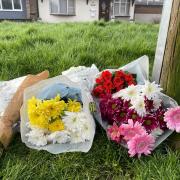 SADNESS: Flowers left near the scene of the alleged murder of Wendy Francis in Haresfield Close, Warndon, Worcester