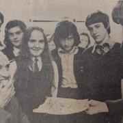 Cookery class students in 1973 tempt outgoing headmaster TDJ (Dennis) Potter, retiring after 19 years, with cakes made for the school Open Night.