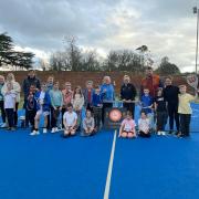 Coaches, parents and youngsters at Boughton Park LTC celebrate the award