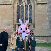 Pictured are (left to right): Rev Gary Crellin, Katy Askew (secretary, Friends of Powick Primary School), pupils Edward Askew and Lydia Crammond, the Easter bunny, pupils Harry Askew and Benjamin Drage and headteacher Martha Worthington.