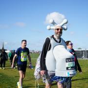 RUNNING:  Marcus Mumford ran the fastest marathon while dressed as a tap