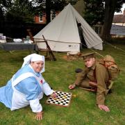BELL TENT: First World War replica Bell Tent in the garden of The Commandery, Worcester, at a previous event in the Worcestershire World War One Hundred Project.VAD Nurse Helen Lee and Worcestershire Regiment soldier, Mark Harding play draughts. Pic by