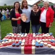 GREAT CAKE: Jane Berry, Katie Harrison, Bernie Heathcote and Joy Roscoe show off their baked patriotic creation at a Queen's birthday celebration in Flyford Flavell