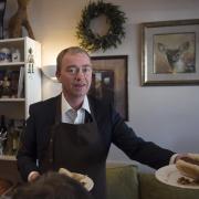HUNGRY: Lib Dem leader Tim Farron serving up the sausage sarnies.