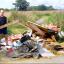 DUMPED: Andrew Brown with fly-tipped rubbish he found on a track off Oldbury Road