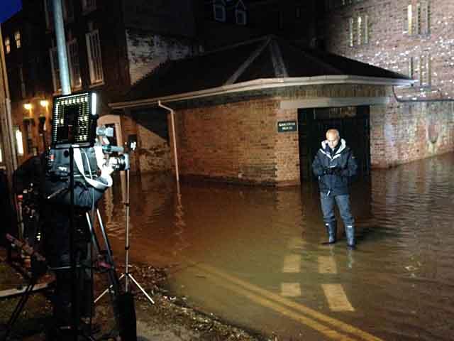 BBC News anchor George Aligiah filming in Worcester during the flooding. By Rachel Ottaway