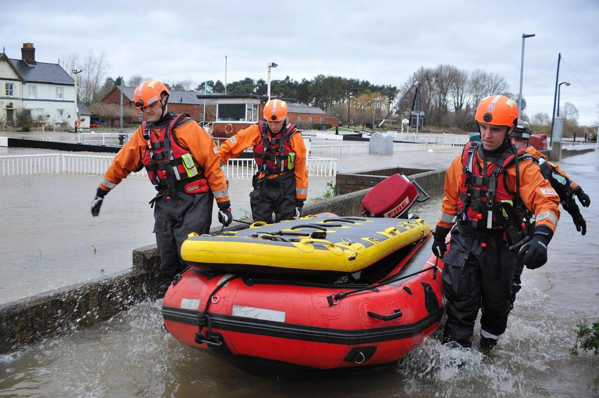 Members of the Hereford and Worcester Fire and Rescue Service in the flood water at Diglis.