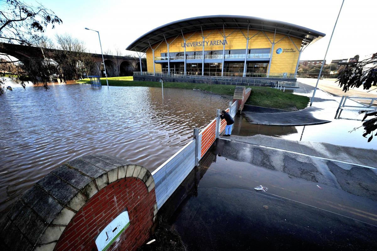 The flood barrier keeps the flood water at bay outside the University Arena on Hylton Road, Worcester. 0714521201