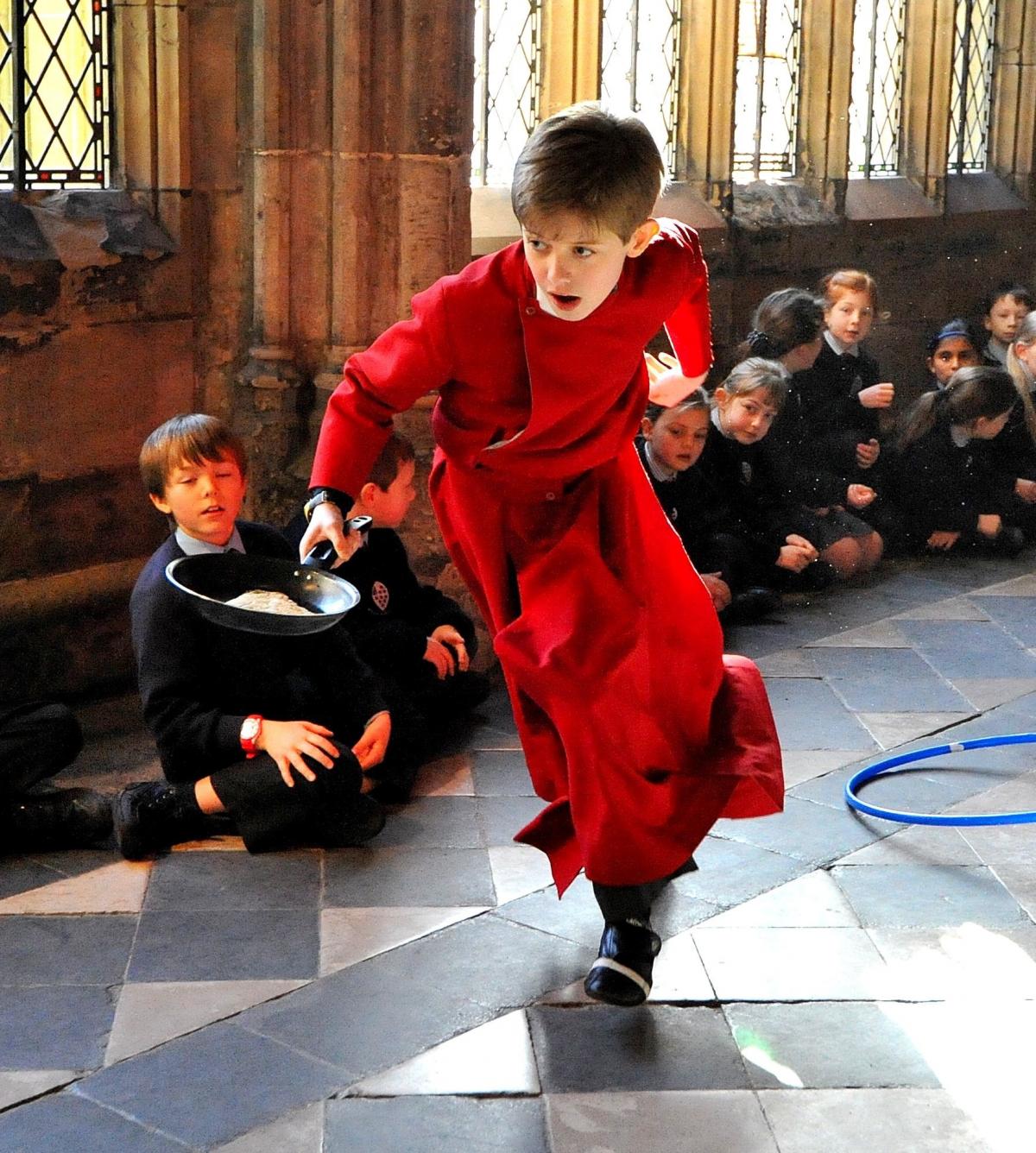 Worcester Cathedral Choir Annual Pancake Races around the Cathedral Cloisters on Tuesday