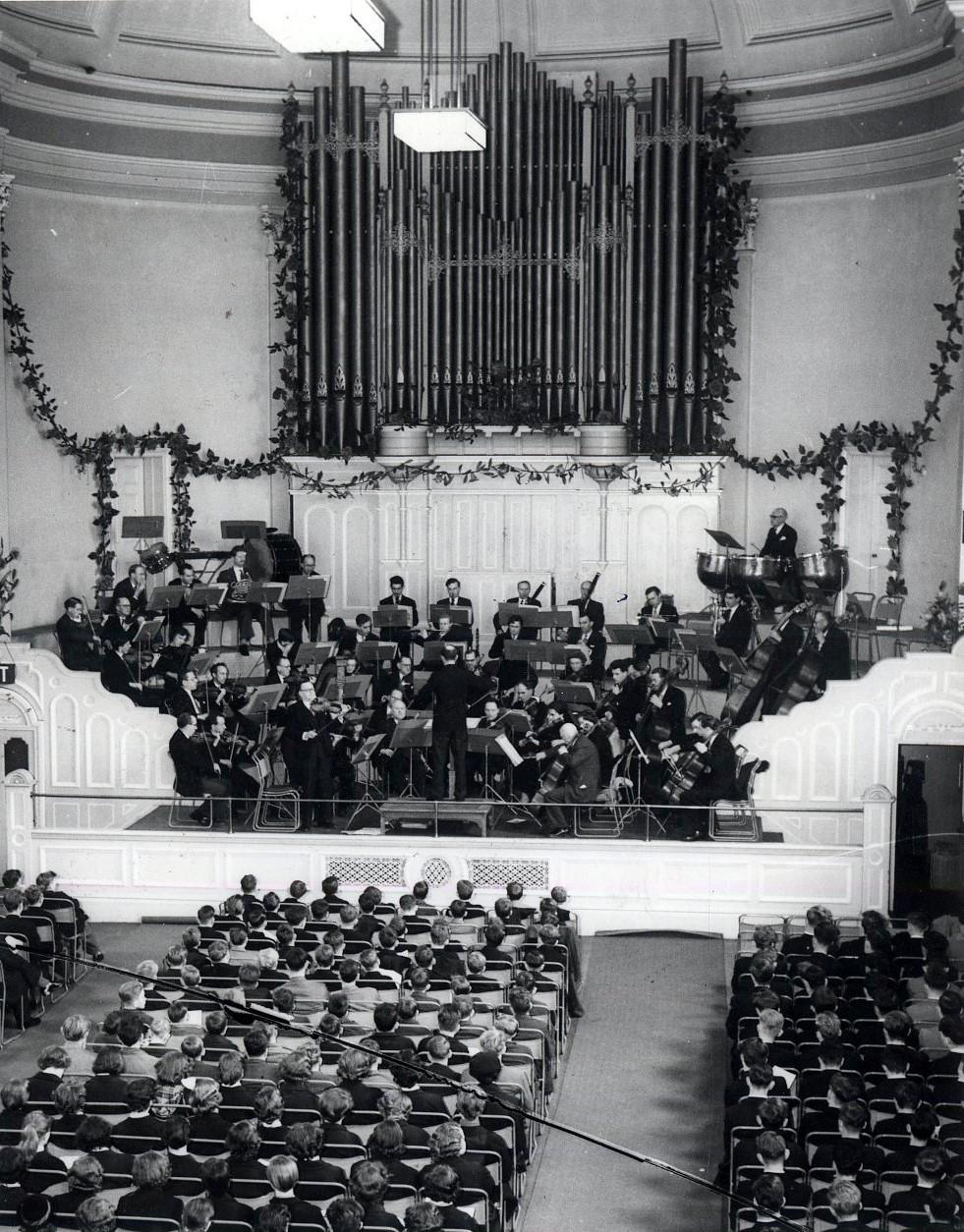 Vanished Worcester. An audience of schoolchildren at an orchestral concert in the Public Hall, Worcester